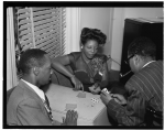 Portrait of Tadd Dameron, Mary Lou Williams, and Dizzy Gillespie at Mary Lou Williams' apartment (New York, N.Y., ca. Aug. 1947)