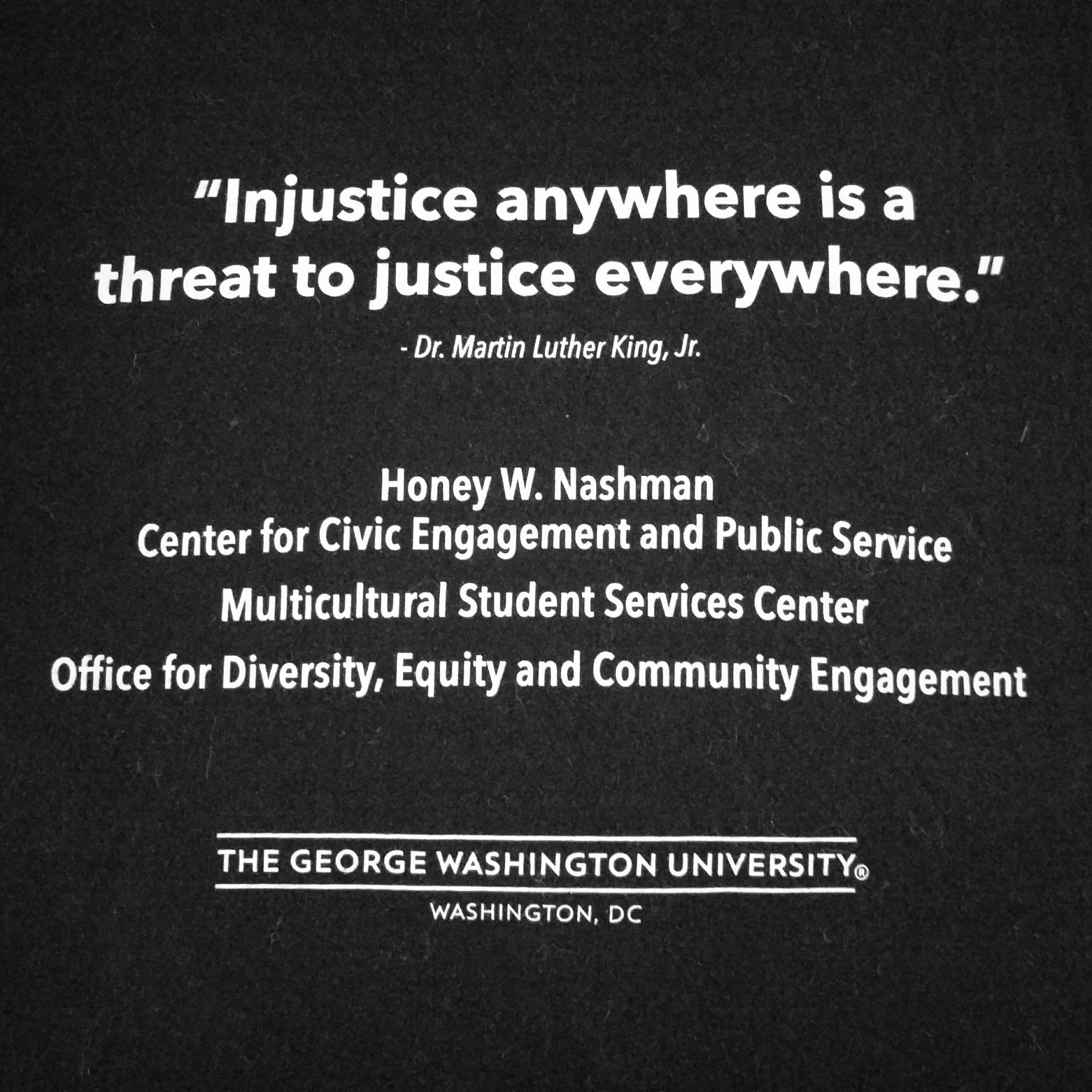 Black poster with the quote "Injustice anywhere is a threat to justice everywhere."