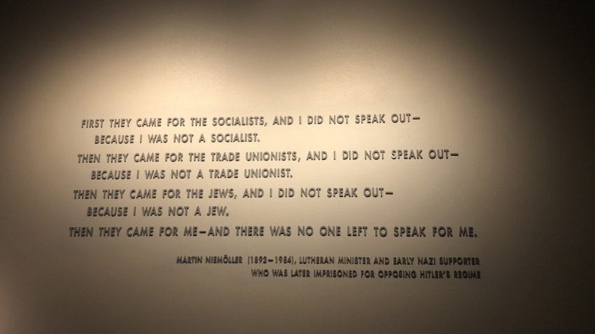 A quote from Martin Niemöller on a tan wall with black writing