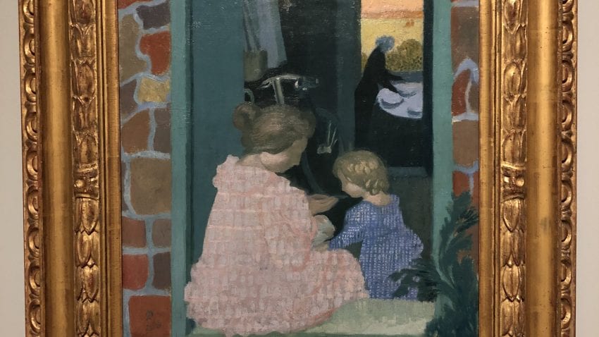 A pastel painting in a frame featuring a woman sitting in a pink dress next to a small child in a blue dress