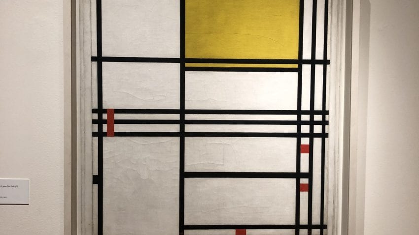 An abstract drawing with black lines and a yellow square in the upper right hand corner