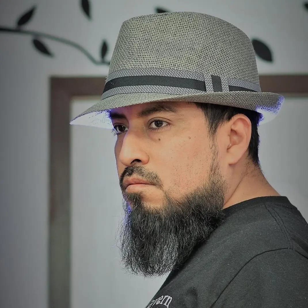 Latino man with hat and beard