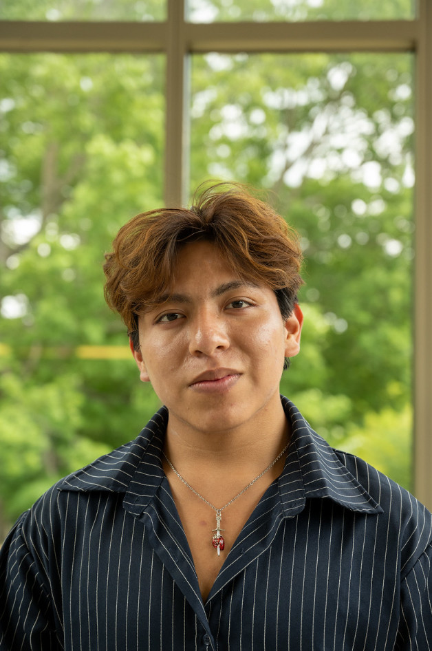 Really attractive latino man with an open dress shirt  and beauitiful hair from bolivia and youg promise of the world 2024 by the unesco.