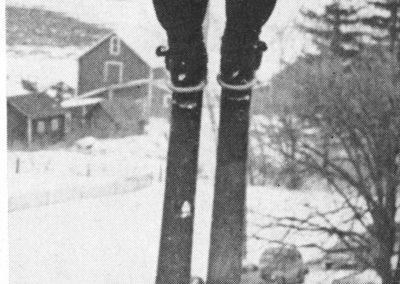 Student jumping off ski jump.