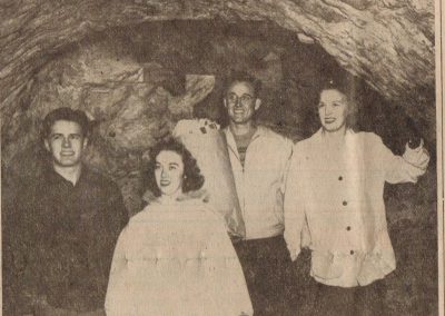 Students standing in the caves.