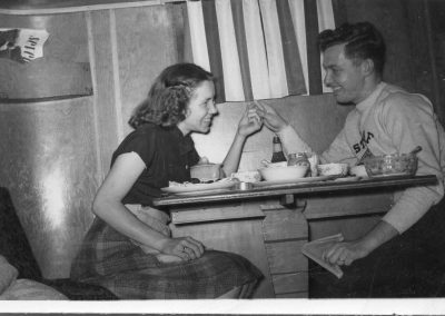 Two residents eating at a table in Viking Court.