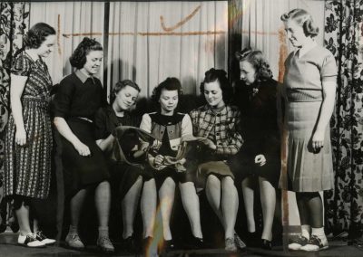 Women holding stockings.