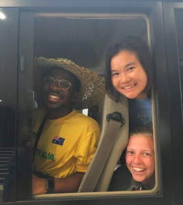 A few of our students popping our head out of our chartered bus! 